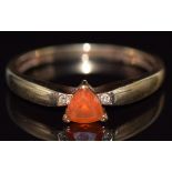 A 9ct gold ring set with a trilliant cut fire opal and diamonds, 1.9g, size O