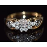 A 9ct gold ring set with diamonds in a cluster, total diamond weight approximately 0.5ct, 3.6g, size