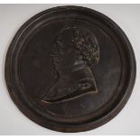 19thC circular cast iron plaque with bust in relief, diameter 34cm