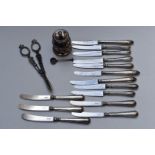 Fourteen hallmarked silver handled knives, hallmarked silver salt spoon, pair of silver plated grape