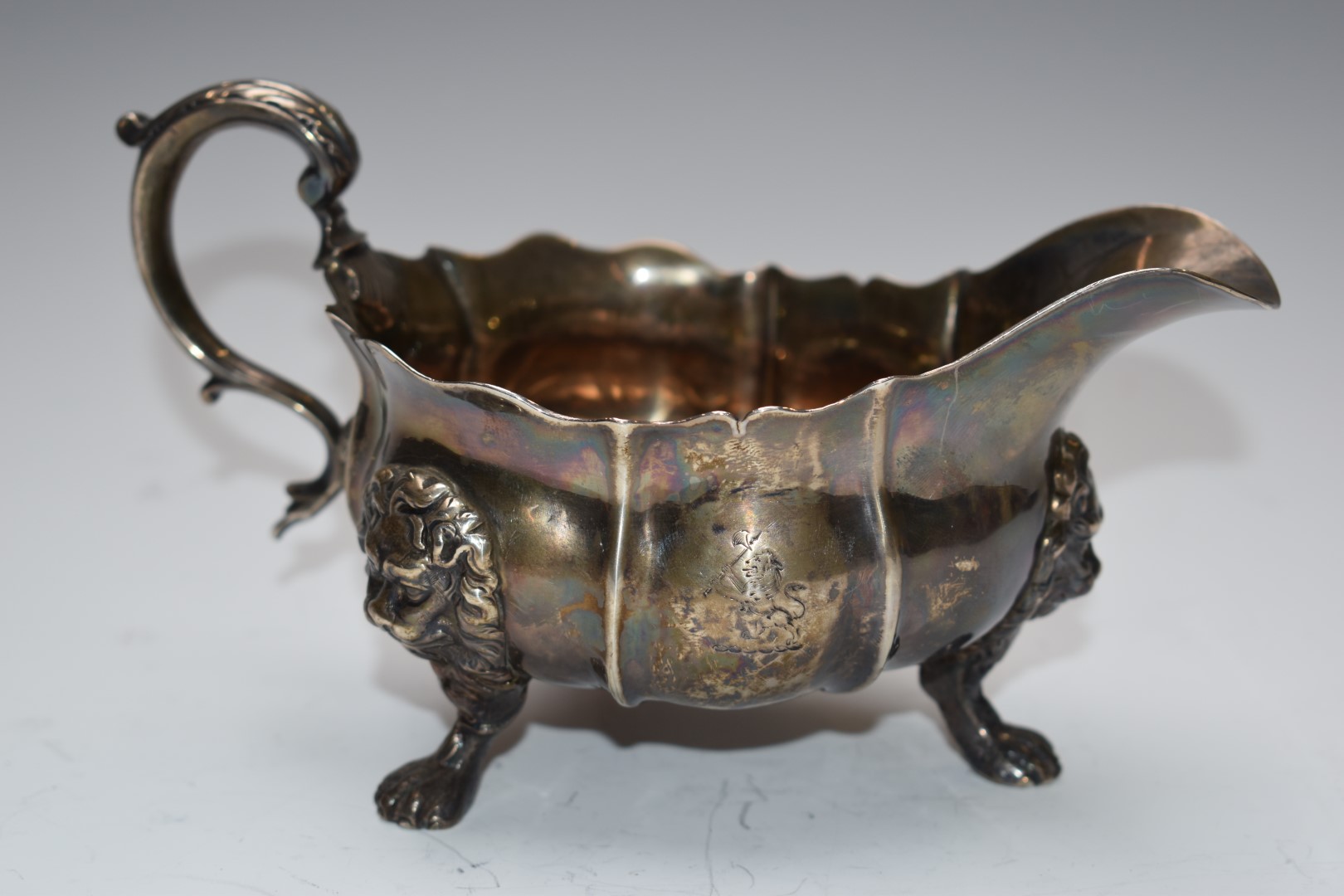 19thC hallmarked silver sauce boat with scrolling handle, raised on lion paw and mask feet, marks - Image 2 of 3