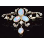 A c1910 gold brooch set with oval opal cabochons and old cut diamonds, 4.9g, 3.7cm long