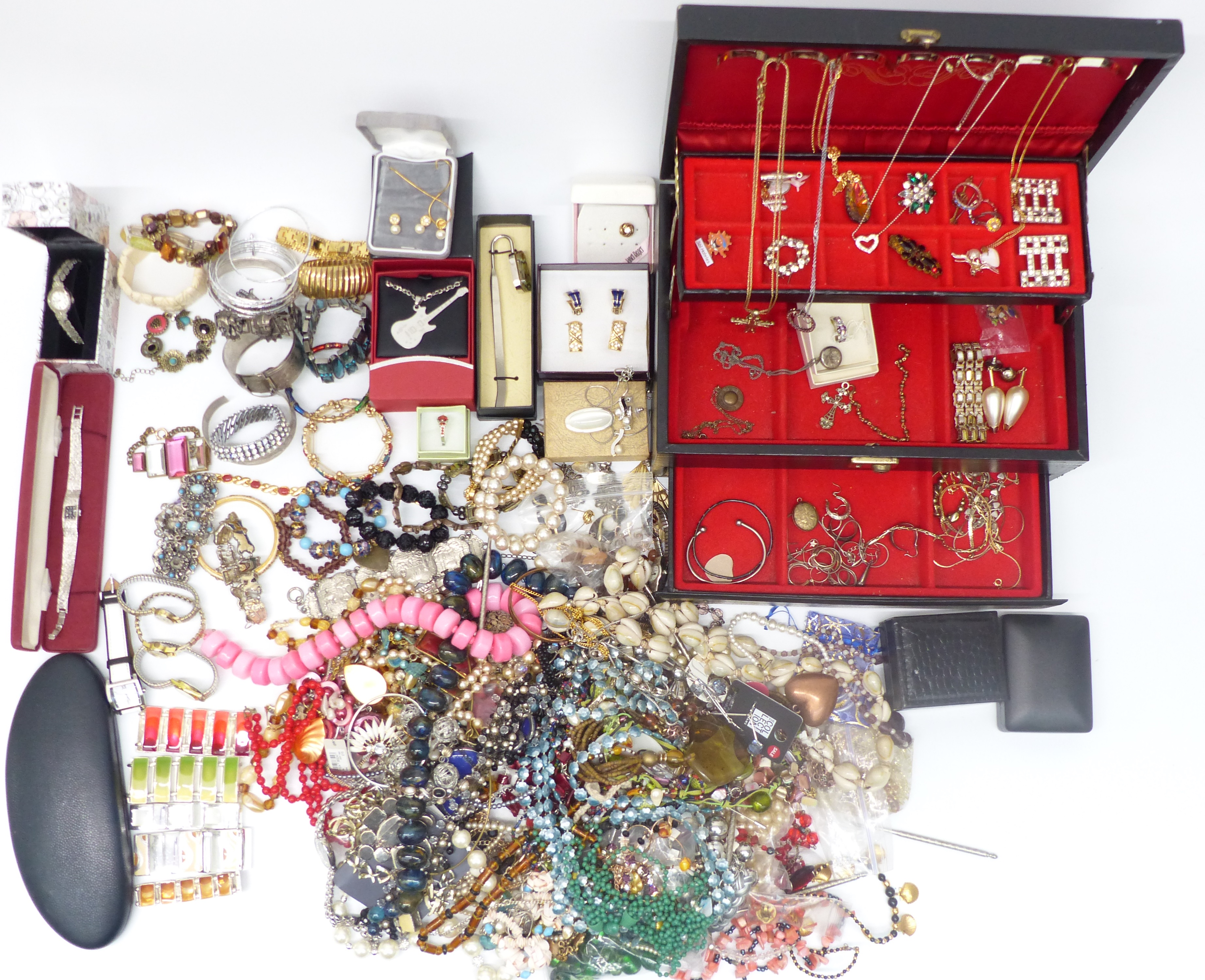 A collection of costume jewellery including silver locket, silver earrings, bangles, bracelets, etc