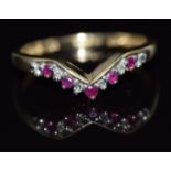A 9ct gold ring set with rubies and diamonds in a V setting, 1.5g, size N