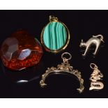 An 18k gold pendant set with malachite, 9ct gold mount (4.1g), copal amber pendant, a 9ct gold