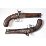 A pair of percussion hammer action pistols with locks signed 'Backwell Devonport', ornately engraved