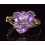 A 9ct gold ring set with oval and round cut amethysts, 2.7g, size P