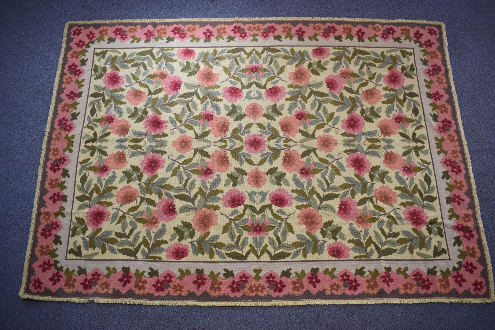 Portuguese hand woven wool rug with pink flowers on a yellow ground, 300m x 220cm