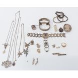 A collection of silver jewellery including ring, bracelets, bangles, chains, brooches, etc