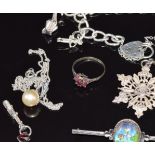 A collection of silver jewellery including charm bracelet, Wedgwood earrings, silver brooches, etc