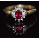 A 9ct gold ring set with a synthetic ruby surrounded by diamonds, 2g, size O