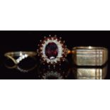 A 9ct gold ring set with garnets (4.6g, size P), a 9ct gold signet ring (0.8g, size N), and a 9ct