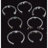 A collection of white metal sections of ring band, 9.5g
