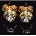 A pair of 18ct gold earrings set with diamonds, 2.1g