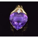 An 18ct gold pendant set with a heart cut amethyst and a diamond, 7.8g, 2.8 x 1.8cm