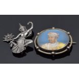 A silver brooch set with an Indian portrait and a Siam silver brooch