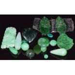 Two jade cabochons, nephrite jade heart, two jade carvings, etc