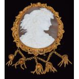 A c1860 gold filigree brooch set with a large cameo of a young woman, with tassel decoration, 5.5