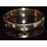 An 18ct gold ring set with diamonds, 3.7g, size P