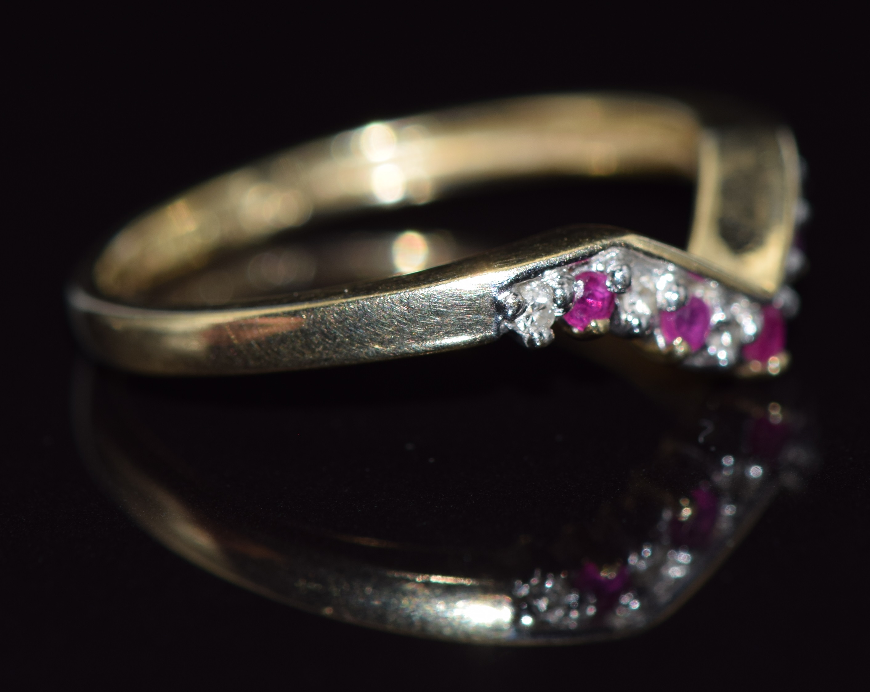 A 9ct gold ring set with rubies and diamonds in a V setting, 1.5g, size N - Image 2 of 2