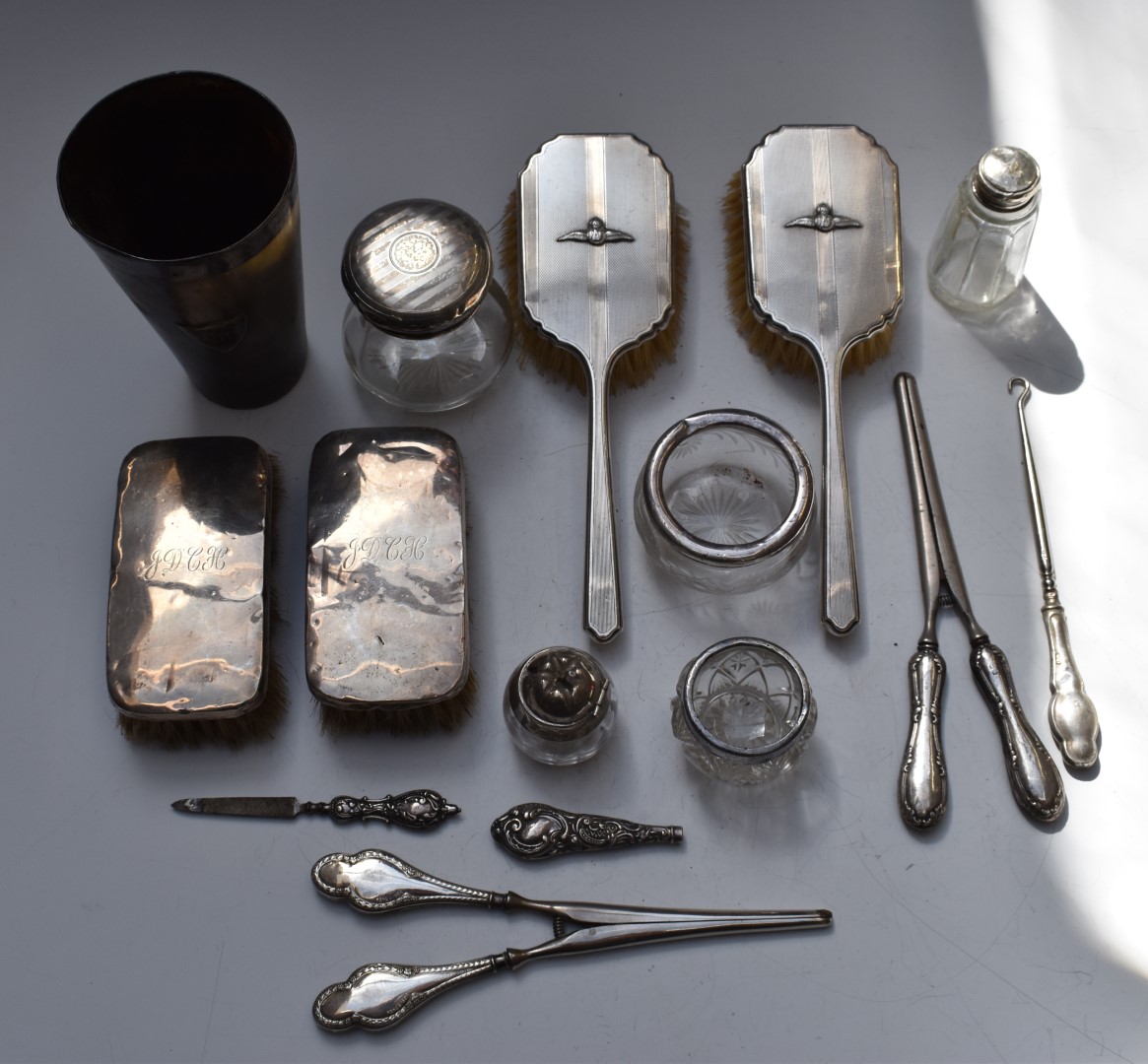 A collection of hallmarked silver dressing table items and silver mounted cut glass including a pair