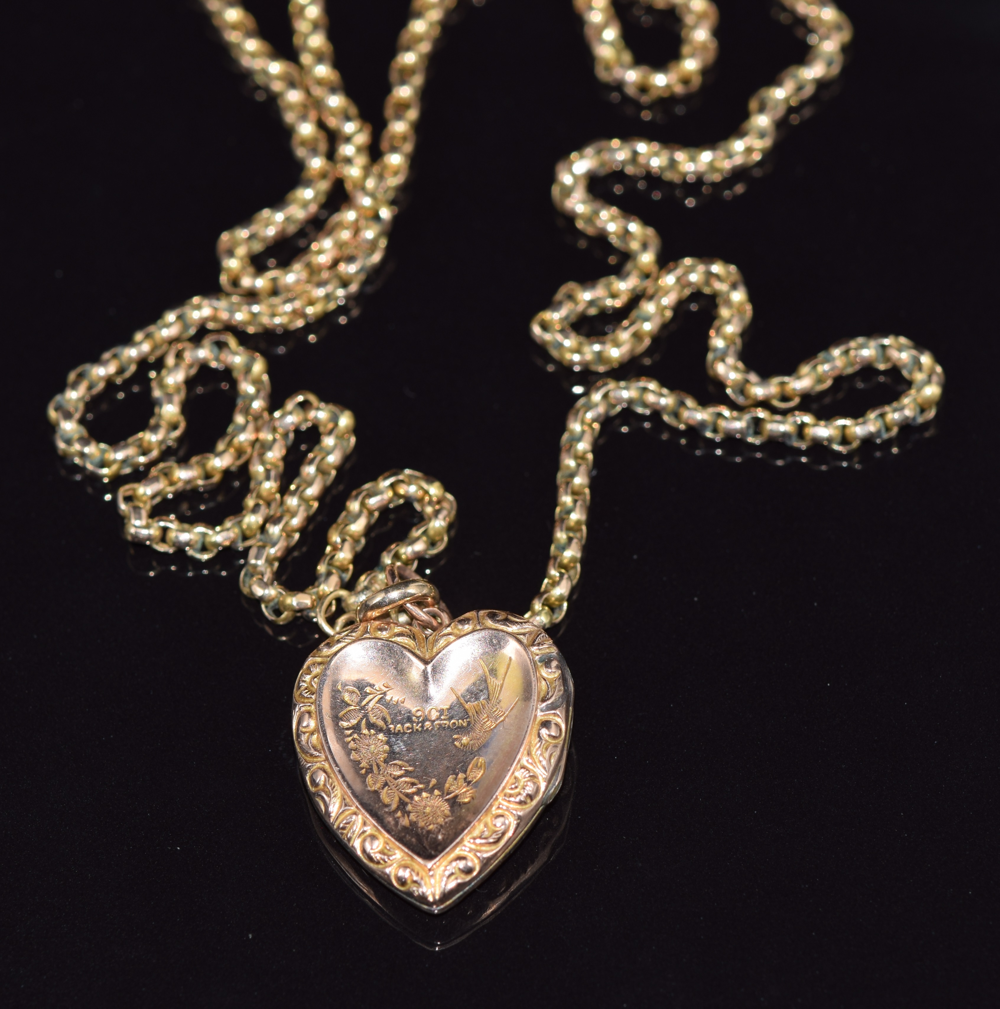 A 9ct gold necklace made up of faceted links and a 9ct back and front heart locket with swallow - Image 2 of 2