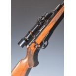 Walther .22 bolt-action rifle with chequered semi-pistol grip, raised cheek piece, magazine,