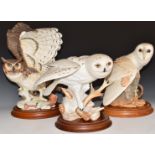 Three Franklin Mint owls Snowy, Barn and Horned, all with wooden bases, tallest 36cm
