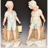 A pair of continental bisque figures of children paddling on a beach, impressed marks verso, H41cm