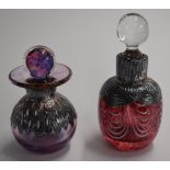 Two glass scent bottles with hallmarked silver overlaid decoration, tallest 10cm
