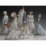 Six Lladro and Nao figures including sweethearts, girls with parasols etc