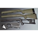 Four composite rifle stocks including one for a Walther G22 and one skeleton example.