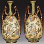 A pair of Vienna twin handled pedestal vases with tube lined decoration of Meconopsis / Himalayan