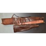 Three leather shotgun slips comprising one 'leg of mutton' (76cm long) and two wool lined.