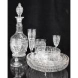A large suite of cut drinking glasses and dessert bowls with hand etched Greek key design in the