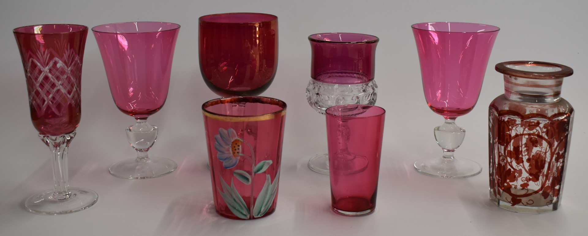 A collection of cranberry glass including enamelled, cut glass, and silver mounted examples, largest - Image 6 of 6