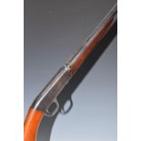 Browning .22 semi-automatic rifle with tube magazine to the stock loaded through wrist, semi-