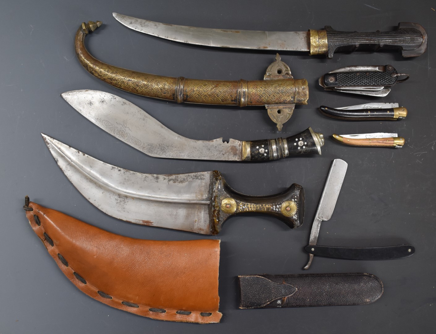 Six various knives / daggers including two oriental examples, kukri and a clasp knife, longest blade