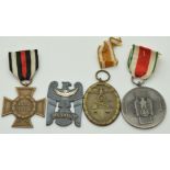 Two German WW2 Third Reich Nazi medals comprising Atlantic Wall and Volkspflege examples together