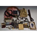 Palestine Police ephemera including leather belt with buckle, truncheon, handcuffs, buttons of