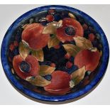 Moorcroft pedestal dish decorated in the Pomegranate pattern with two open pomegranates, H5 x D20.