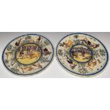 Pair of 19thC Spanish chargers decorated with bullfighting scenes, diameter 36.5cm