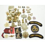 Collection of military badges and buttons including The Royal Scots, Black Watch, Royal Artillery,