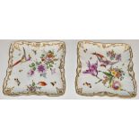 A pair of Chelsea style shallow dishes with bird of paradise decoration, impressed and gilded anchor