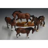 Four Beswick horses comprising Spirit of Earth, Swish Tail, Mare Facing Right and Standing Shire