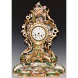 A 19th/20thC continental porcelain flower encrusted mantel clock and stand, H46cm