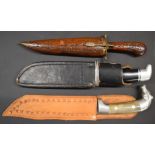 Three hunting knives comprising Buck 119 Bowie knife with 6 inch blade, a Mexican example with