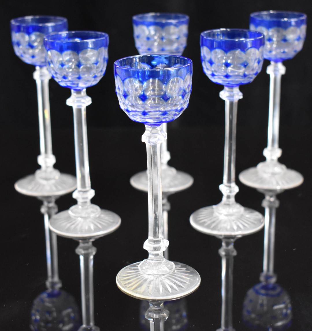 A set of six blue overlay cut glass liqueur glasses with octagonal stems and star cut bases, 14. - Image 2 of 2