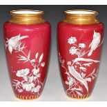 Pair of Minton pate sur pate vases decorated with birds and flowers, H21cm