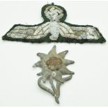 German Army WW2 Gebirgsjager Mountain Troops Edelweiss metal badge, together with a cloth officer'